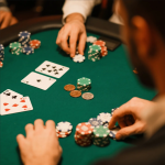 Poker player managing chips and bankroll at the table